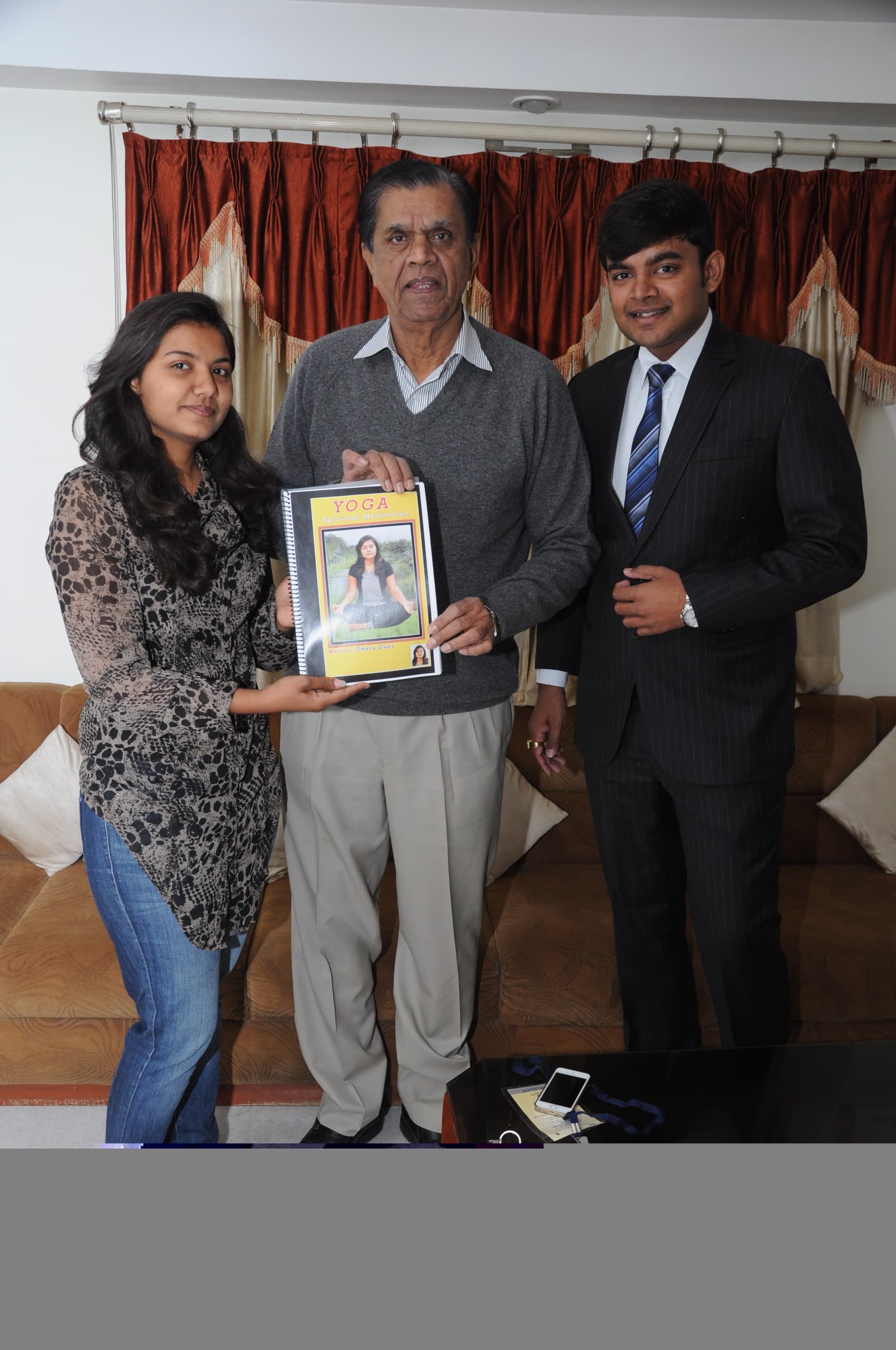 Dr. Dhara Dani presenting the Spiritual Yoga book to a distinguished guest