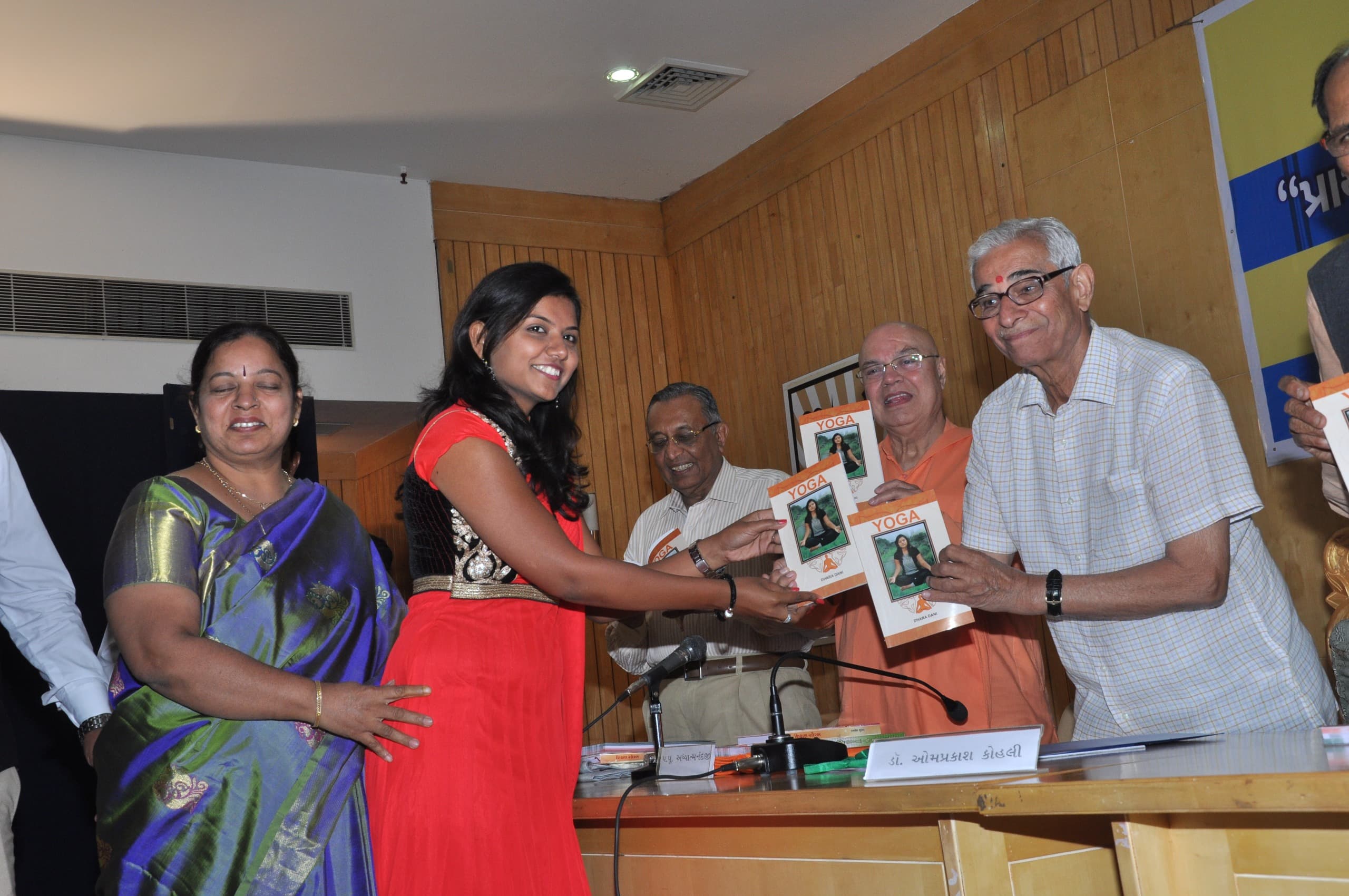 Spiritual Yoga book launch ceremony with Dr. Dhara Dani presenting the book