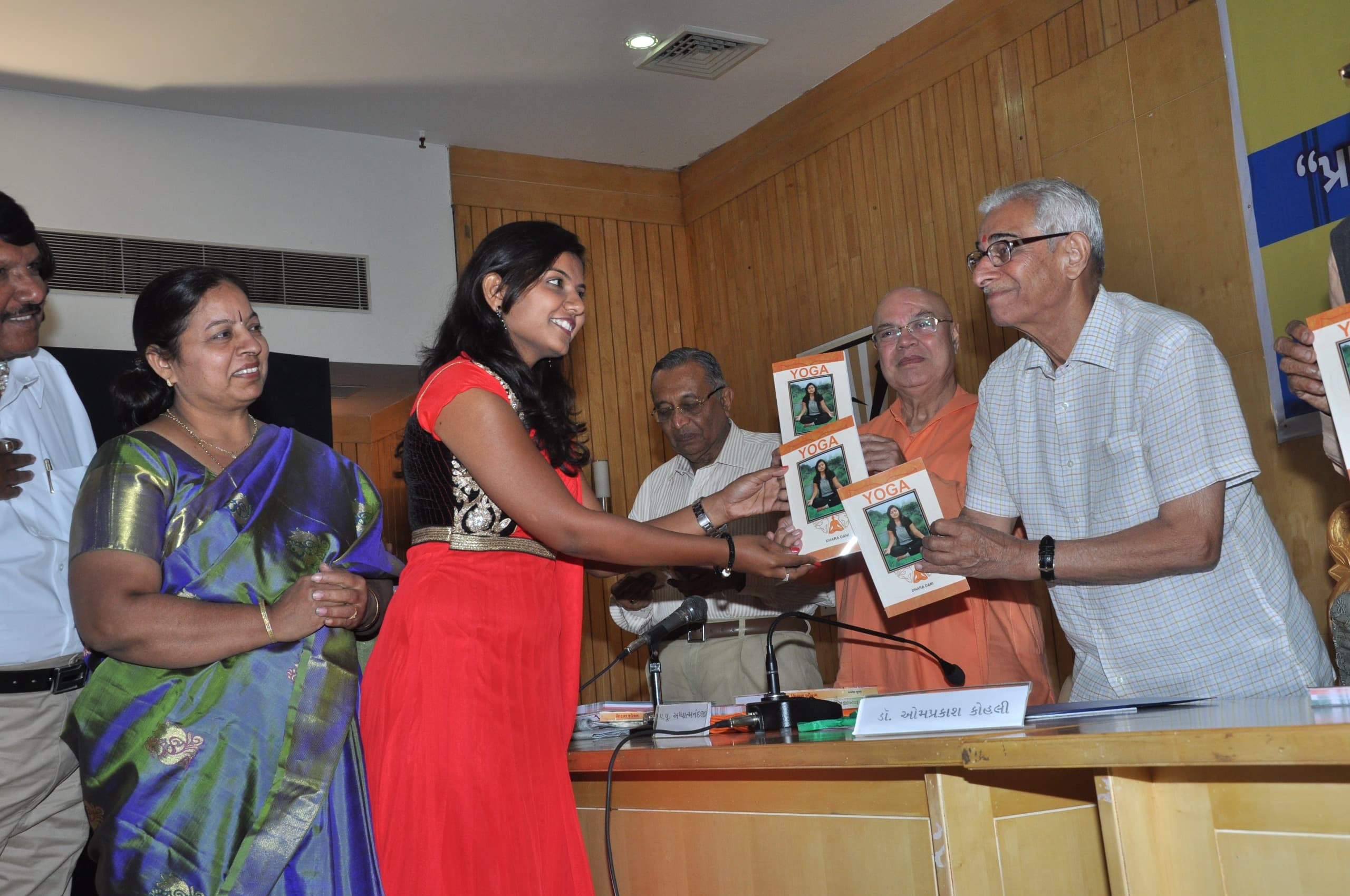 Dr. Dhara Dani at book inauguration with dignitaries on stage