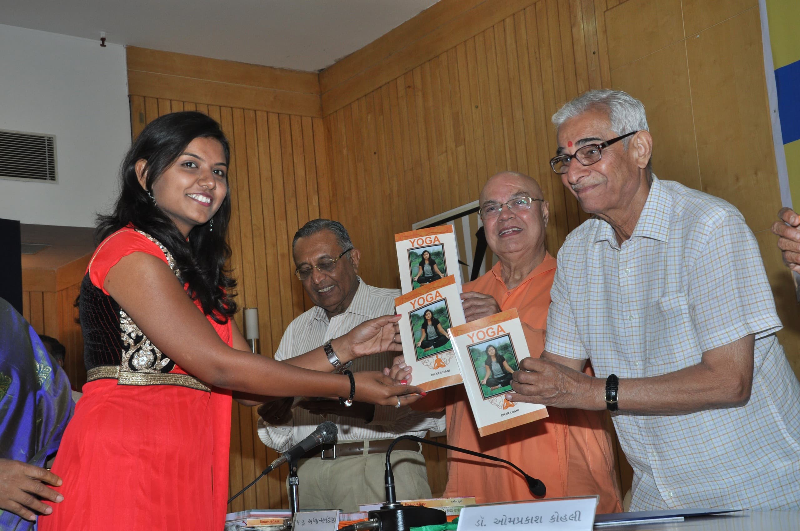 Dr. Dhara Dani presenting Spiritual Yoga book at launch event