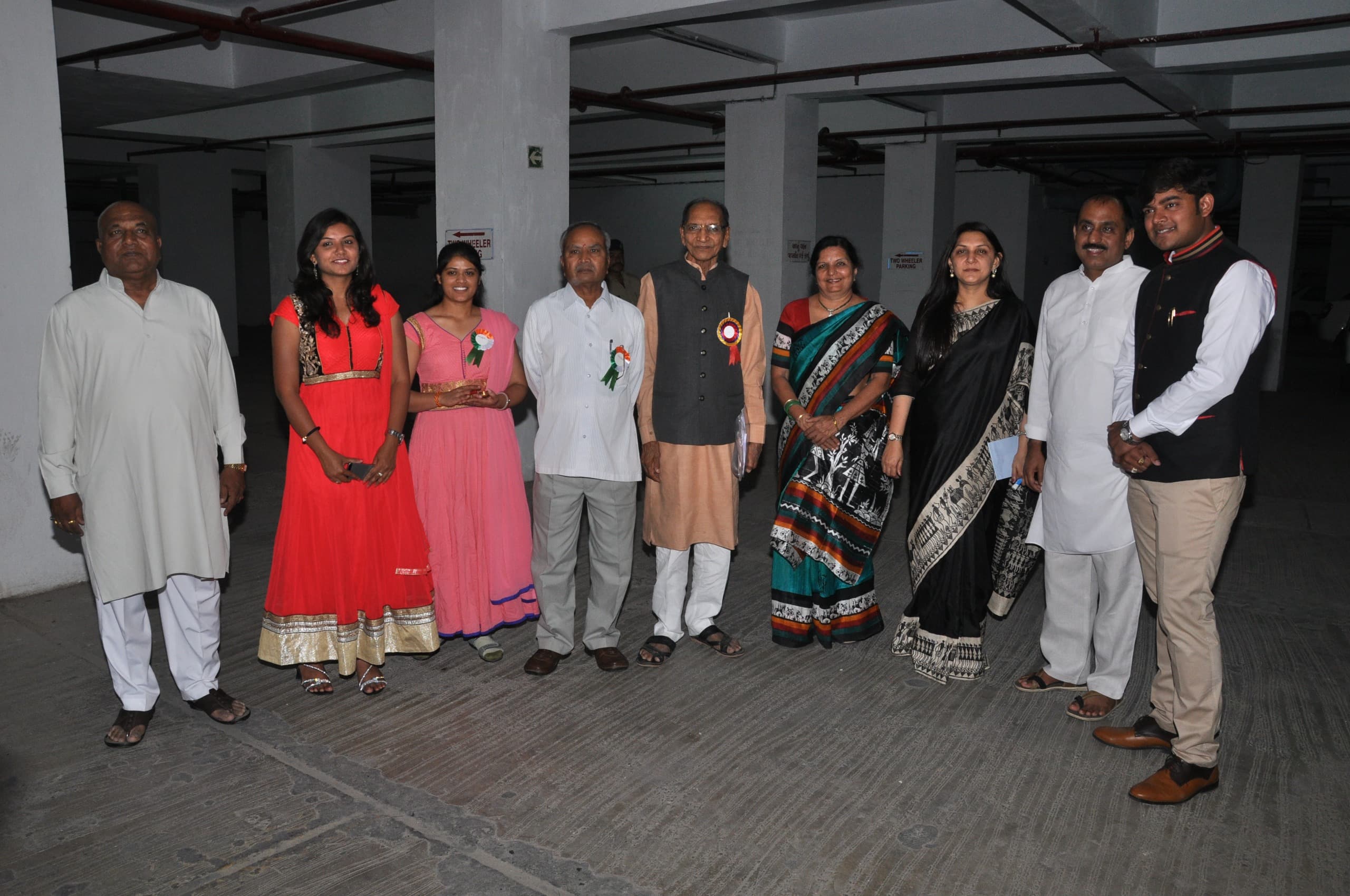 Dr. Dhara Dani group photo at a formal event with dignitaries
