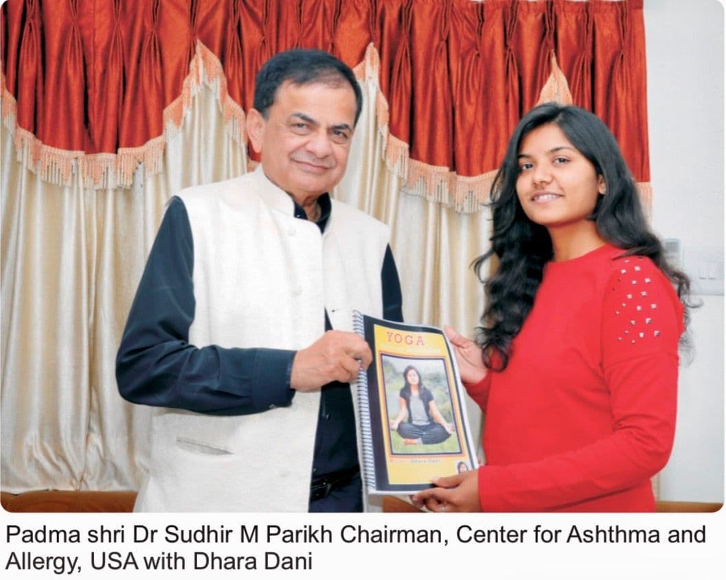 Padma Shri Dr Sudhir M Parikh Chairman Center for Asthma and Allergy USA with Dhara Dani holding YOGA Spiritual Meditation book
